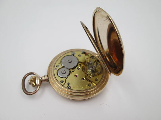 Favor hunter-case pocket watch. Gold plated metal. Stem-wind. Porcelain dial. 1920's