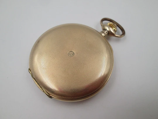 Favor hunter-case pocket watch. Gold plated metal. Stem-wind. Porcelain dial. 1920's
