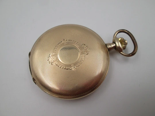 Favor hunter-case pocket watch. Gold plated metal. Stem-wind. Porcelain dial. 1920's