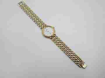Festina mujer. Acero inoxidable y chapado oro. Cuarzo. Brazalete. Dial blanco. 1990