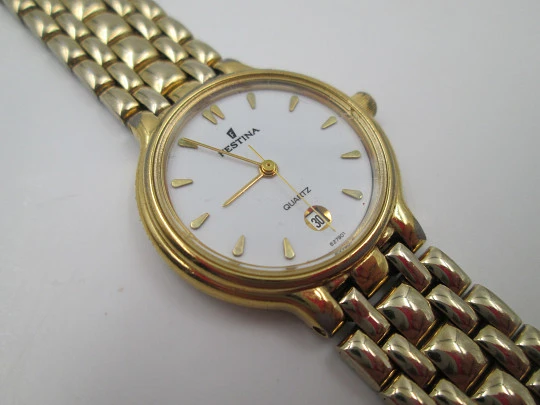 Festina mujer. Acero inoxidable y chapado oro. Cuarzo. Brazalete. Dial blanco. 1990