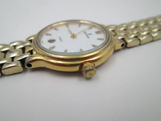 Festina mujer. Acero inoxidable y chapado oro. Cuarzo. Brazalete. Dial blanco. 1990