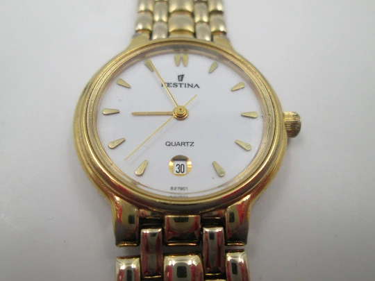 Festina mujer. Acero inoxidable y chapado oro. Cuarzo. Brazalete. Dial blanco. 1990