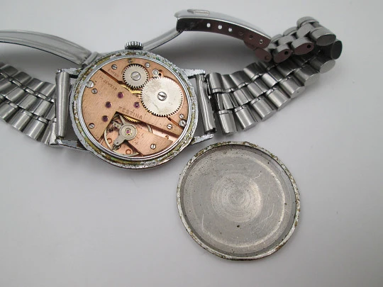 Festina. Acero y metal cromado. Cuerda manual. Segundero. Brazalete. 1950. Suiza