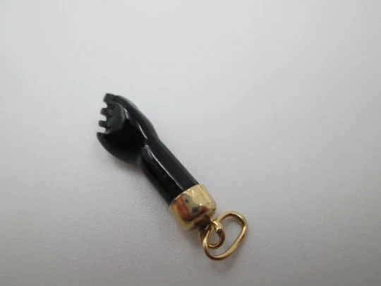 Figa / higa pendant. Black hand. 18 karat gold and yet. Amulet. Spain