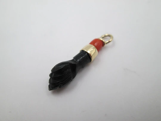 Figa / higa pendant. Black hand. 18 karat gold. Coral sphere & jet. Amulet. 1950's