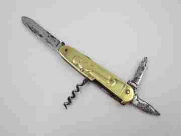 Figurative pocket knife. Brass and steel. Embossed bagpiper and woman. 1930's