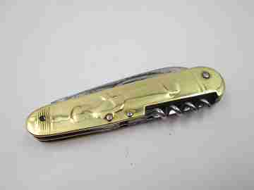 Figurative pocket knife. Brass and steel. Embossed bagpiper and woman. 1930's
