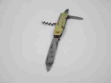 Figurative pocket knife. Brass and steel. Embossed bagpiper and woman. 1930's