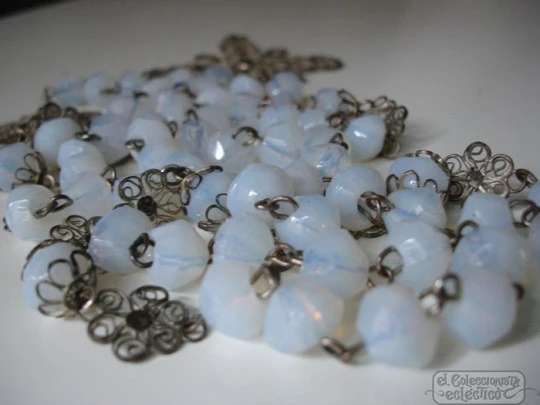 Filigree rosary. Silver-plated and white crystal. Faceted beads