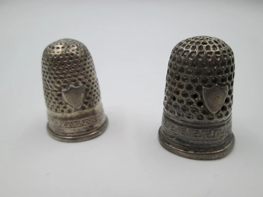 Five sewing thimbles. Sterling silver. Hammer texture & ornate motifs