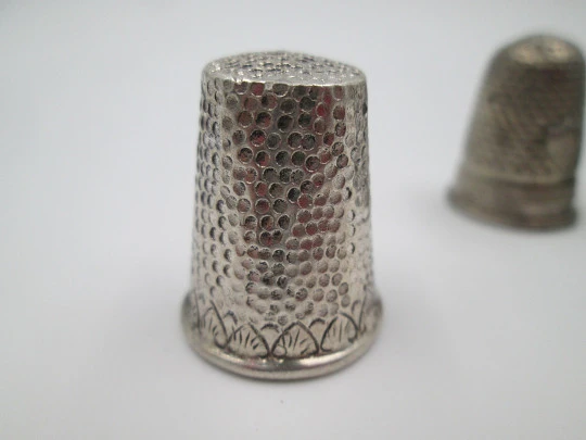 Five sewing thimbles. Sterling silver. Hammer texture & ornate motifs