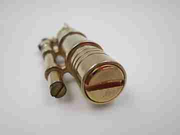 Flint wheel & wick cigarette lighter. Gold plated metal. Tubular shape. 1980's