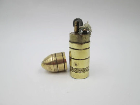 Flint wheel & wick cylindrical petrol cigarette lighter. Gold plated. Floral motifs. 1960's