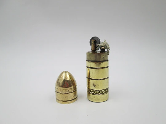 Flint wheel & wick cylindrical petrol cigarette lighter. Gold plated. Floral motifs. 1960's