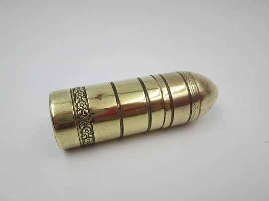 Flint wheel & wick cylindrical petrol cigarette lighter. Gold plated. Floral motifs. 1960's