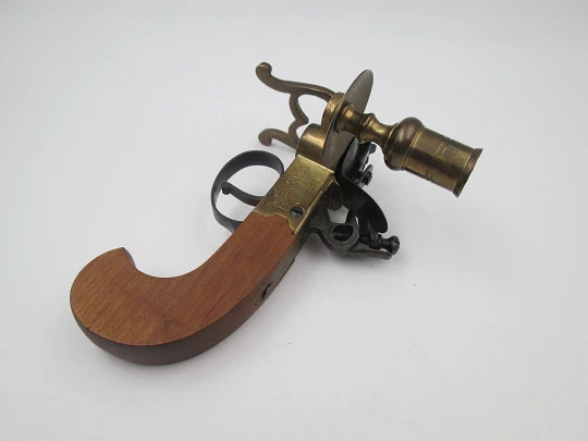Flintlock tinder pistol lighter with candle holder. Iron and brass. Wooden handle. Italy