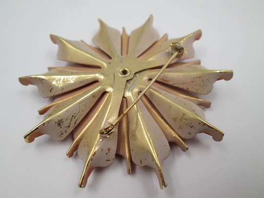 Flower brooch. Golden metal and red enamel. Circa 1960's. Europe