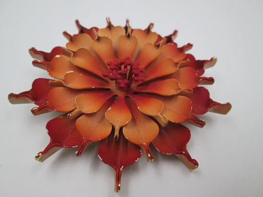 Flower brooch. Golden metal and red enamel. Circa 1960's. Europe