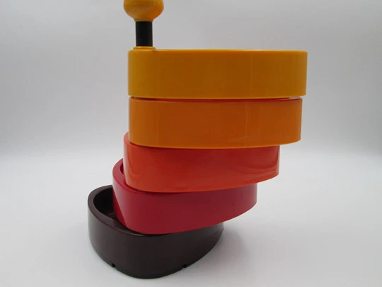 Food centerpiece. Rotating trays and support. Colored plastic. 1960's