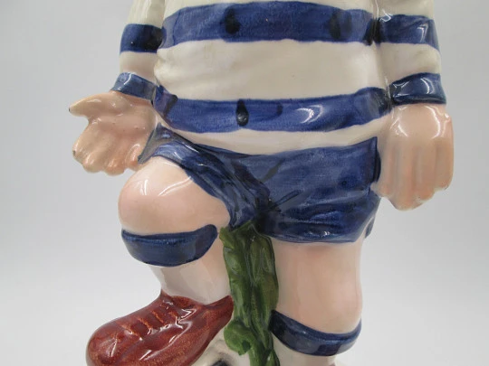 Football player wind-up musical bottle. Melody & movement. Polychrome ceramic