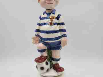 Football player wind-up musical bottle. Melody & movement. Polychrome ceramic