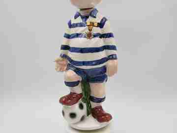 Football player wind-up musical bottle. Melody & movement. Polychrome ceramic