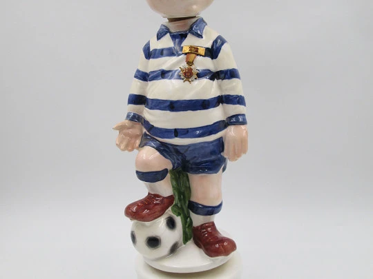 Football player wind-up musical bottle. Melody & movement. Polychrome ceramic