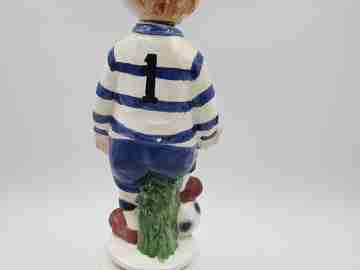 Football player wind-up musical bottle. Melody & movement. Polychrome ceramic