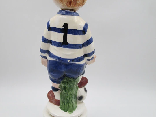 Football player wind-up musical bottle. Melody & movement. Polychrome ceramic