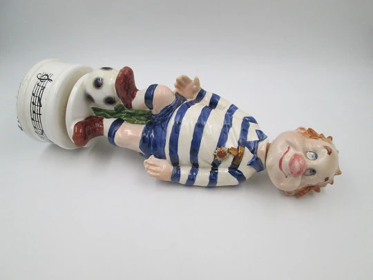 Football player wind-up musical bottle. Melody & movement. Polychrome ceramic