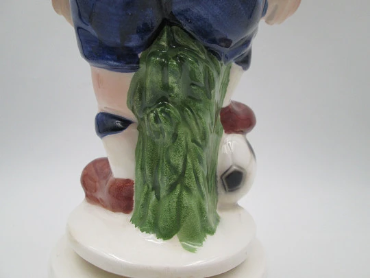 Football player wind-up musical bottle. Melody & movement. Polychrome ceramic