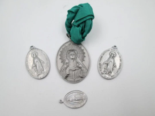 Four aluminum medals collection. Virgin of Hope and Immaculate Conception. 1940's