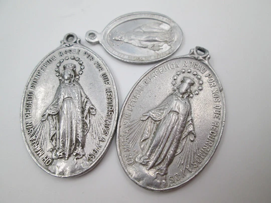 Four aluminum medals collection. Virgin of Hope and Immaculate Conception. 1940's