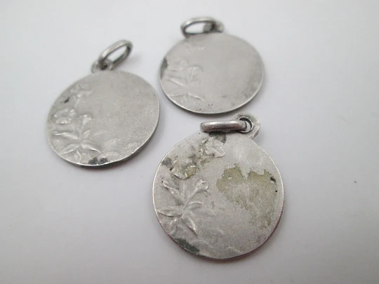 Four religious medals. Sterling silver. Virgin, Christ and Saints. 1960's Four religious medals. Sterling silver. Virgin, Christ and Saints. 1960's