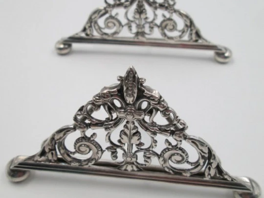 Four table place card holders. Silver plated. 1940's. UK. Openwork