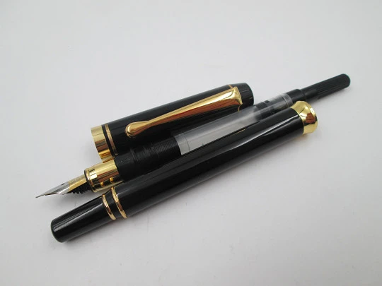 Genius Da Vinci. Black lacquer & gold plated. Converter. Bitone nib. Germany. 2000's