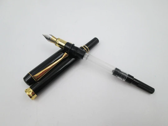 Genius Da Vinci. Black lacquer & gold plated. Converter. Bitone nib. Germany. 2000's