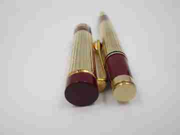 Genius / Peruzzo. Gold plated metal & burgundy resin. Swarovski crystal. Italy. 2000's