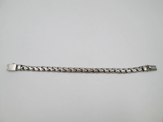 Gentleman curb bracelet with braided links. Sterling silver. Tab clasp. 1990's. Spain