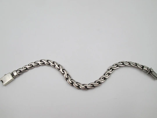 Gentleman curb bracelet with braided links. Sterling silver. Tab clasp. 1990's. Spain