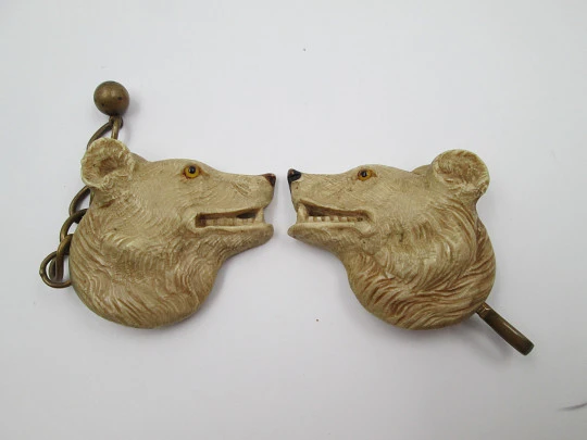 Gentleman's cape / cloak clasp. Grey resin and golden metal. Wolves heads. Europe. 1950's