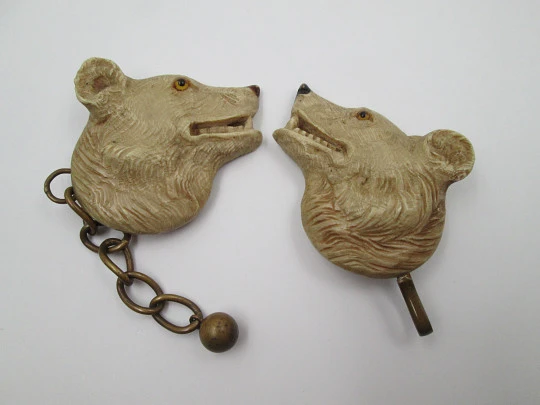 Gentleman's cape / cloak clasp. Grey resin and golden metal. Wolves heads. Europe. 1950's