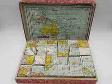 Geographic puzzle cardboard cubes. World map brainteaser. 1950's