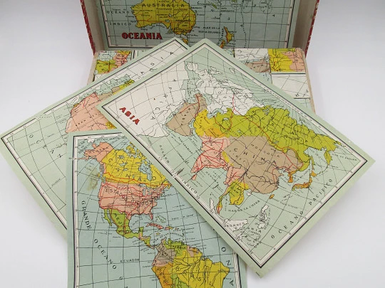 Geographic puzzle cardboard cubes. World map brainteaser. 1950's