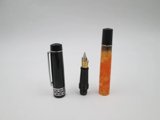 German fountain pen. Orange and black pearl resin. Silver plated details. Golden nib. 2005's