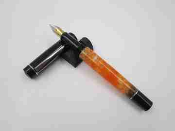 German fountain pen. Orange and black pearl resin. Silver plated details. Golden nib. 2005's