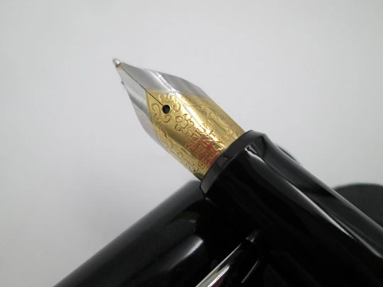 German fountain pen. Orange and black pearl resin. Silver plated details. Golden nib. 2005's