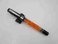 German fountain pen. Orange and black pearl resin. Silver plated details. Golden nib. 2005's