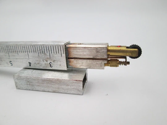 Graduated ruler pocket butane lighter. Silver plated metal. Original box. Europe. 1980's